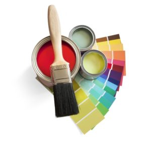 coloured swatches and paint pot and paintbrush on white background